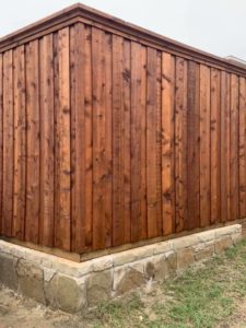 fence maintenance - new stained wood fence