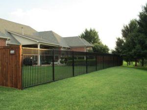 hardscape maintenance - wrought iron fence around backyard area